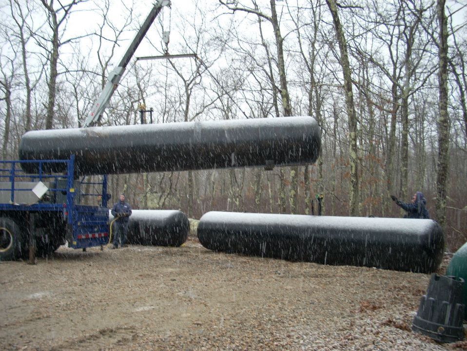 Propane tanks being installed in the snow