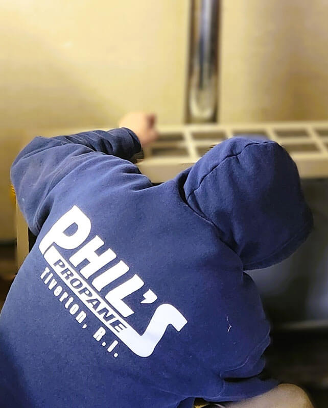 technician repairing a propane space heater