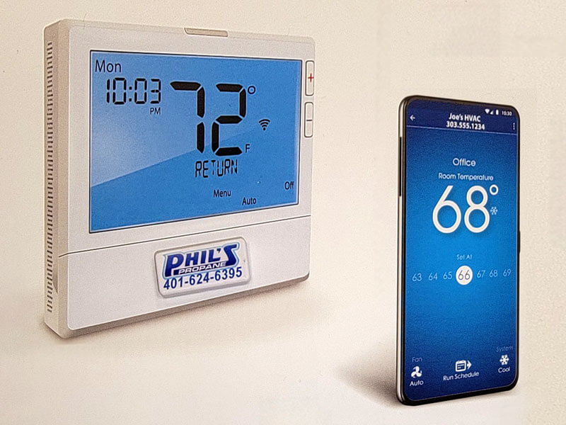 Pro1 Thermostat next to smart phone with app display