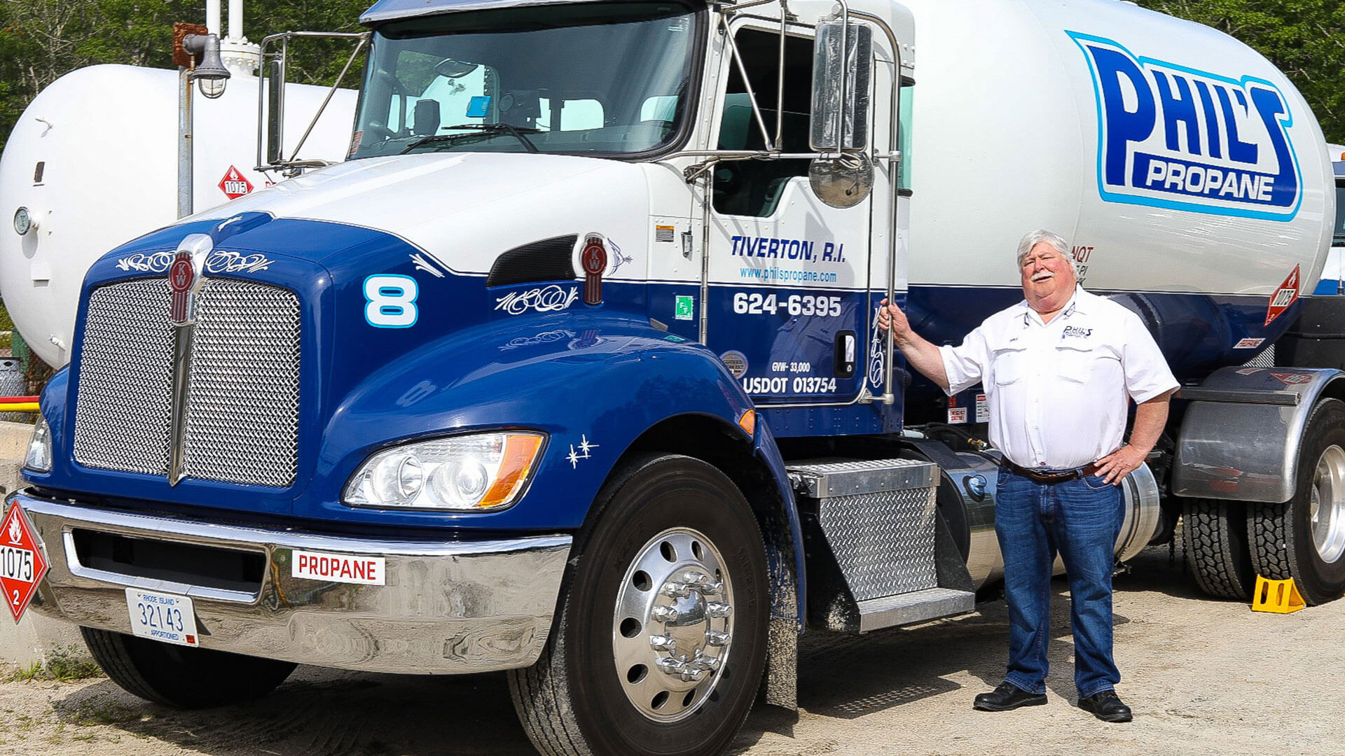 owner in front of Phil's Propane tanker truck