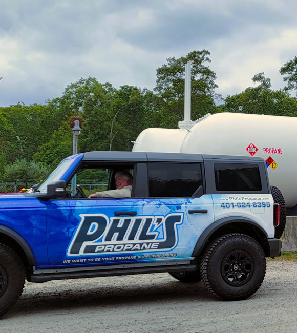 phils company vehicle in front of propane tanks